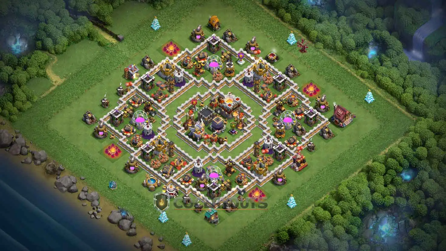 A clash of clans th11 base featuring a standard hybrid setup with the Town Hall and Eagle Artillery sharing the middle zone.